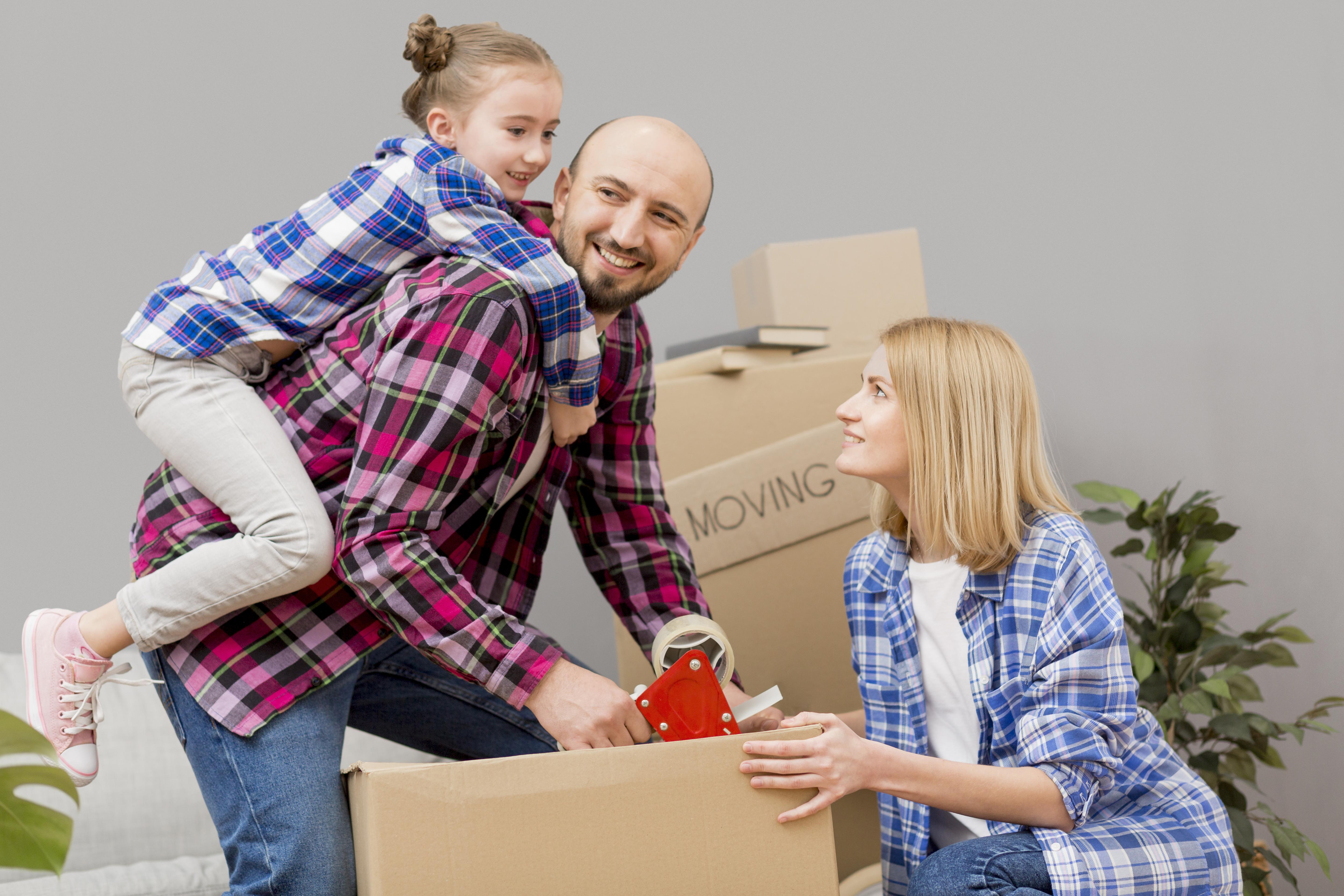  Family with moving boxes using storage units in Waxahachie, TX, during a major life transition
